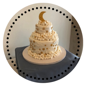 White and gold moon and stars cake.